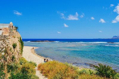 Scenic view of sea against blue sky