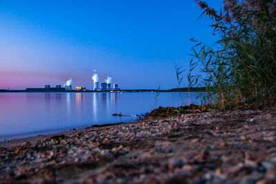 Scenic view of sea against clear blue sky