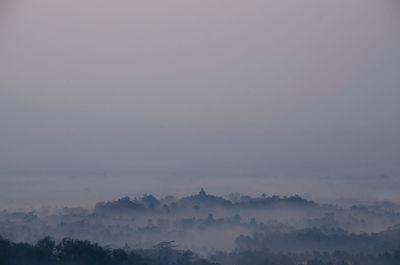 Scenic view of landscape against sky during sunset