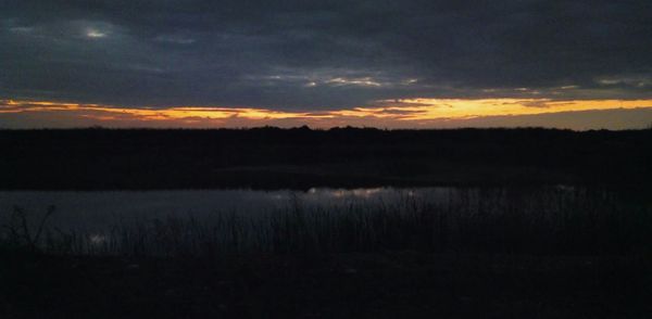 Scenic view of landscape at sunset