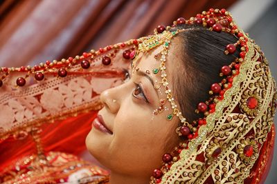 Close-up portrait of woman wearing mask