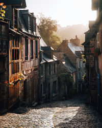 Footpath amidst buildings in town