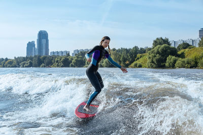 Woman wakesurfing in moskva river