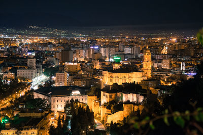 High angle view of illuminated buildings in málaga city at night