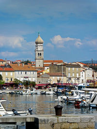 Boats moored at harbor