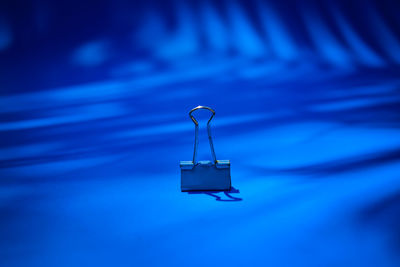 Close-up of padlocks hanging on metal