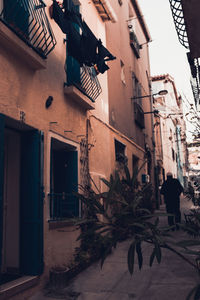 Houses by street in city