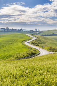 High angle view of road by landscape against sky