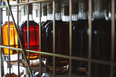 Close-up of wine bottles in glass