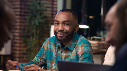 Portrait of young man using digital tablet