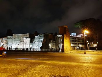 Buildings in city at night