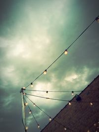 Low angle view of light bulbs against sky