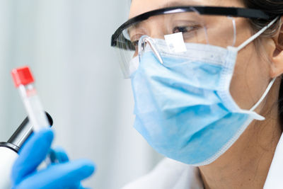 Midsection of person wearing mask
