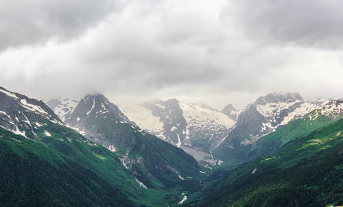 Snow-capped peaks of mountains in summer, dombay