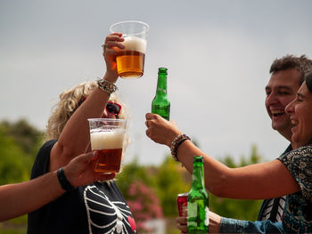 Young woman drinking beer glass