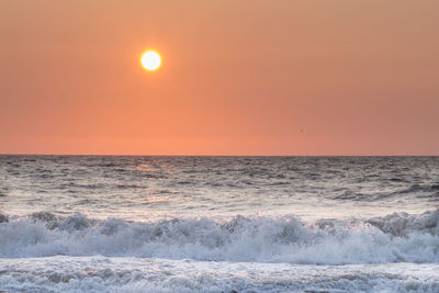 Scenic view of sea at sunset