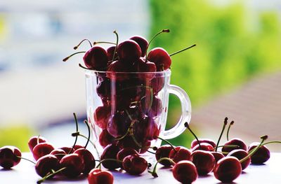 Close-up of cherries on table