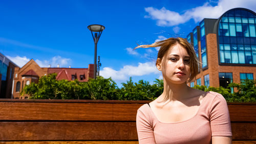 Portrait of beautiful woman against sky