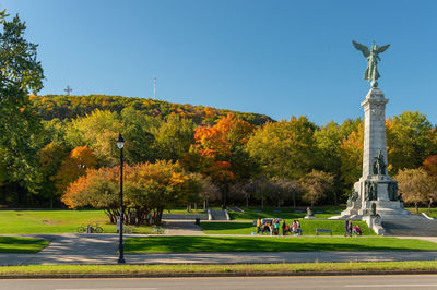 Statue in park during autumn