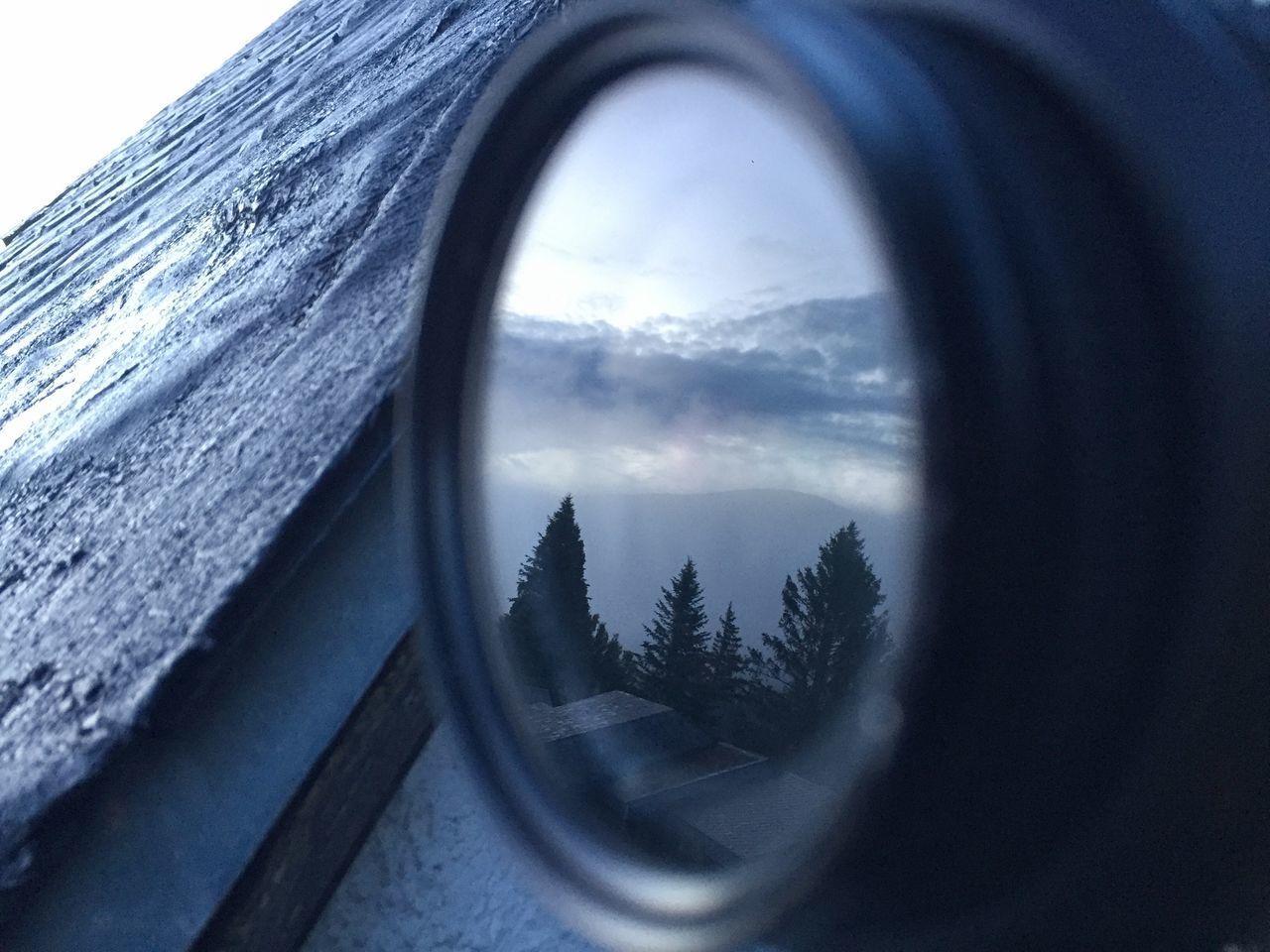 REFLECTION OF SKY ON GLASS WINDOW