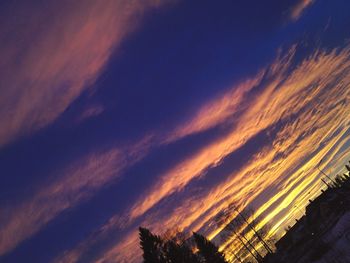 Low angle view of cloudy sky at sunset