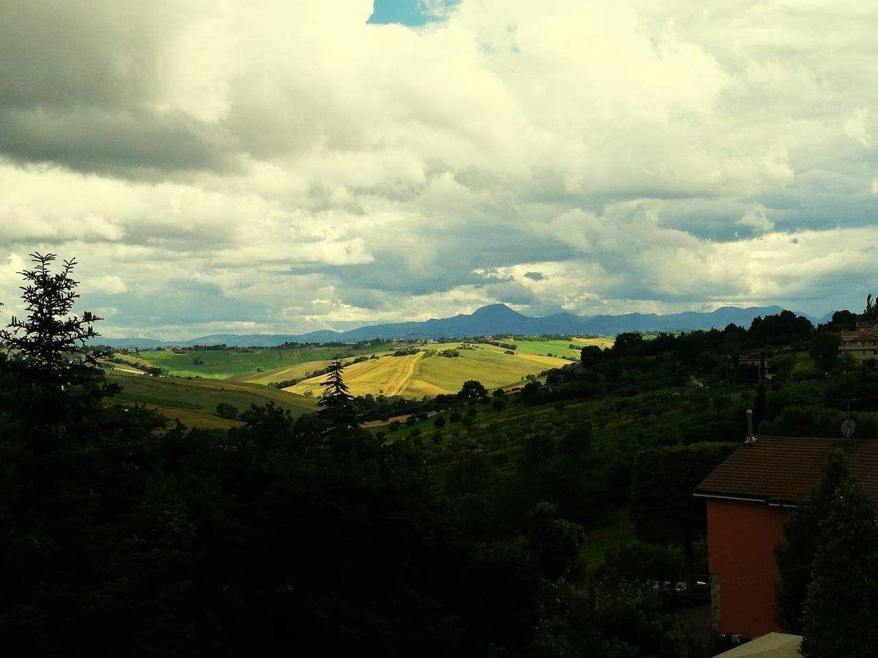 sky, cloud - sky, tranquil scene, landscape, scenics, tranquility, tree, cloudy, beauty in nature, cloud, nature, house, built structure, building exterior, architecture, mountain, field, idyllic, rural scene, outdoors