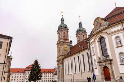 Low angle view of buildings against sky in city