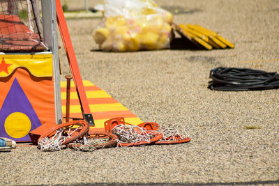 Close-up of yellow shoes on road