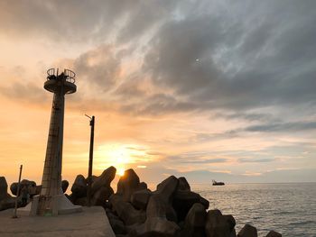 Scenic view of sea against sky at sunset