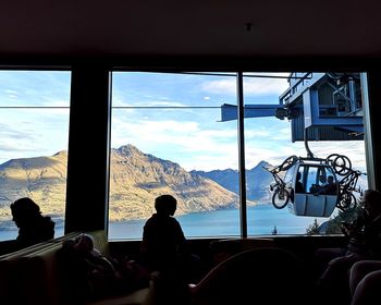 People looking through window