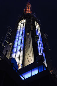 Low angle view of illuminated building at night