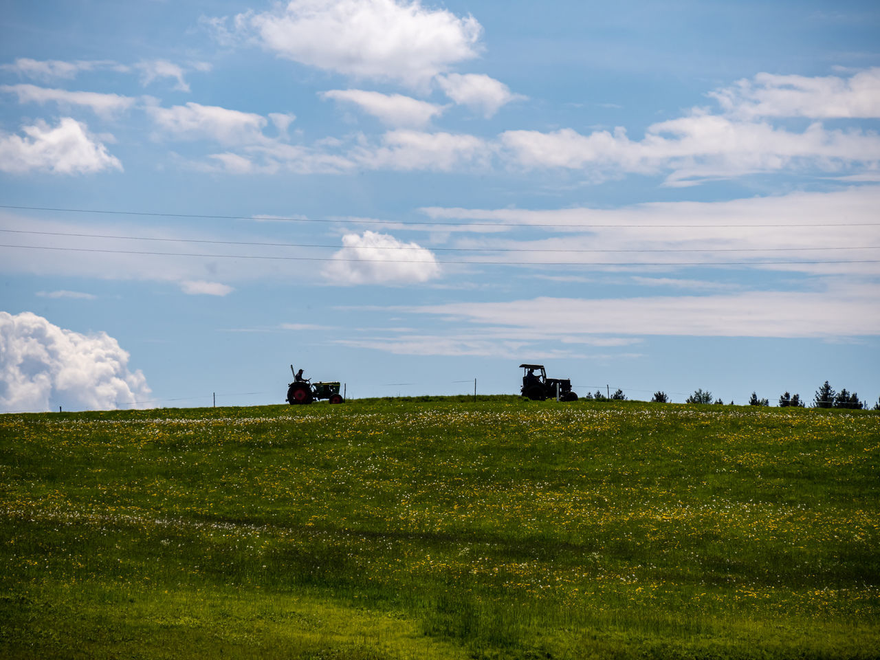 cloud - sky, sky, field, land, landscape, environment, scenics - nature, beauty in nature, grass, plant, nature, green color, day, no people, transportation, mode of transportation, rural scene, tranquil scene, tranquility, outdoors