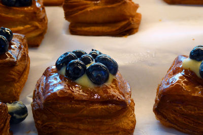 High angle view of blueberries on pastries at store