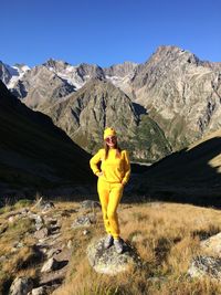 Man standing on mountain against sky