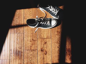 Close-up of shoes on wood