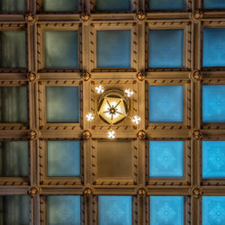 Directly below shot of illuminated chandelier on ceiling