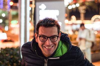 Portrait of smiling man in city