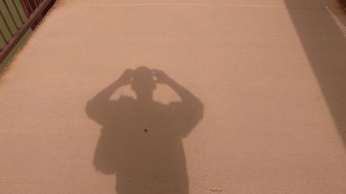 Shadow of man on sand