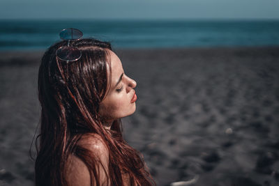 Woman looking at sea shore