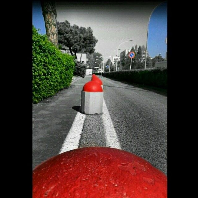 red, architecture, building exterior, built structure, the way forward, transfer print, auto post production filter, road, street, road marking, sky, diminishing perspective, transportation, day, vanishing point, flag, no people, outdoors, guidance, sunlight