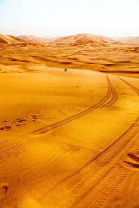 Scenic view of desert against clear sky