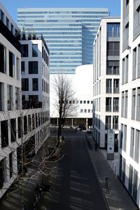 Street amidst buildings in city against sky