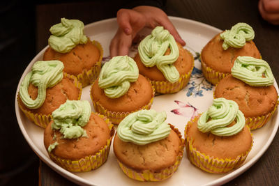 Close-up of cupcakes in plate on table