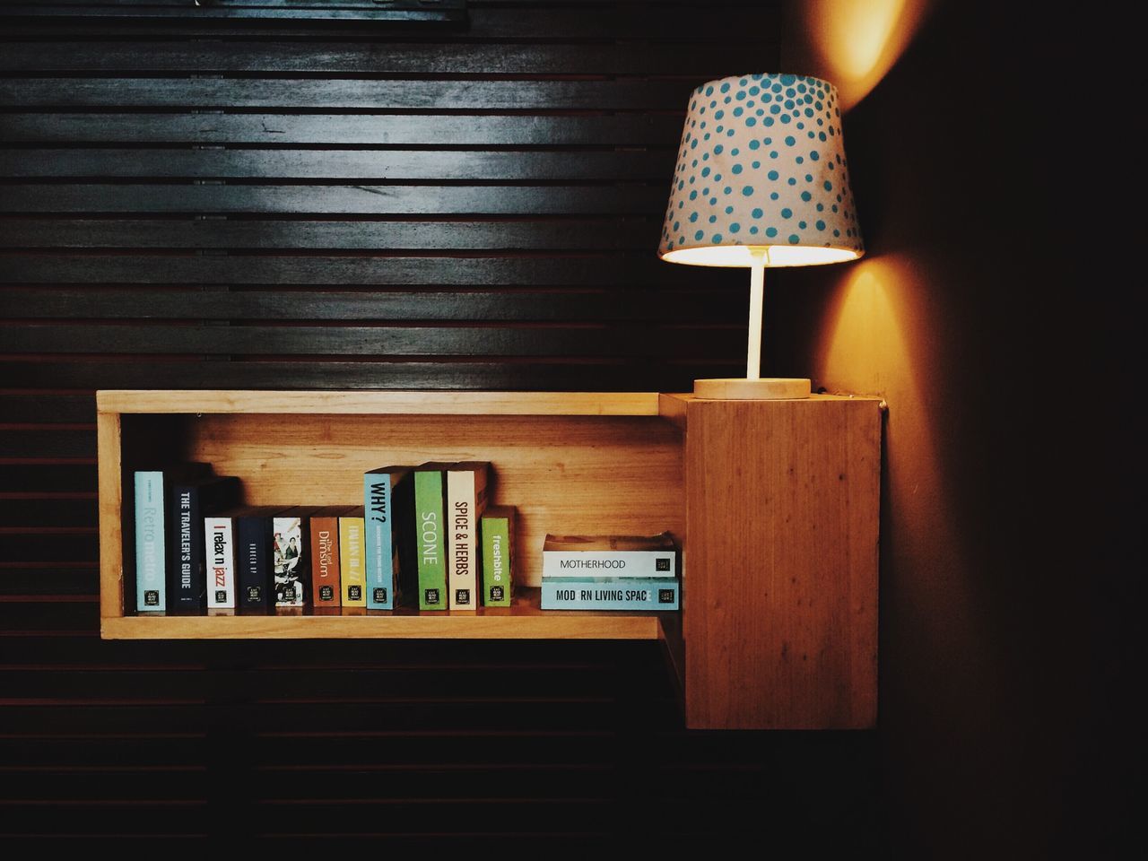 indoors, illuminated, lighting equipment, wood - material, still life, text, electricity, hanging, in a row, wall - building feature, close-up, no people, candle, shelf, communication, night, lit, light - natural phenomenon, glowing, table