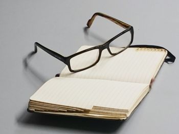 Studio shot of glasses and note pad