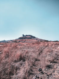 Scenic view of land against clear sky