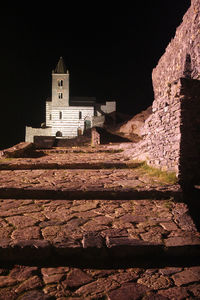 Castle against sky at night