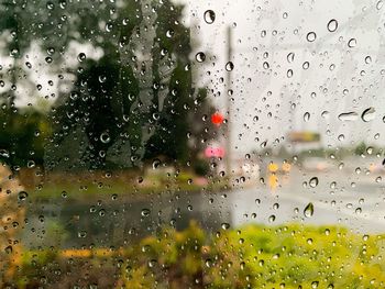 Raindrops on glass window during rainy season