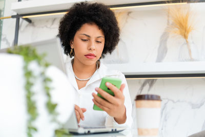 Young woman using mobile phone