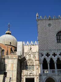 Low angle view of building against blue sky